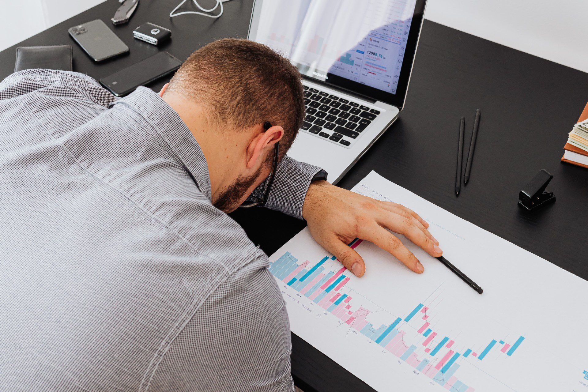 Office Worker Slumped Over Desk